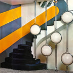 AstraLume gulv-til-loft lampe med beige halvkugler