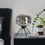 Lámpara de mesa de vidrio ahumado Lyra con diseño moderno de trípode