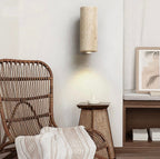 Vegglampe i svart travertin