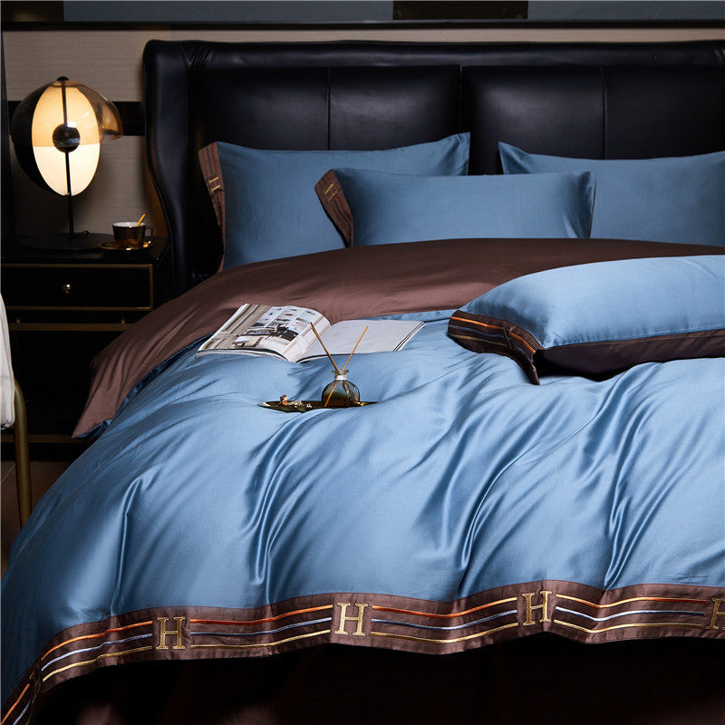Set di biancheria da letto in cotone satinato ricamato Luminoir, quattro pezzi per camere da letto eleganti
