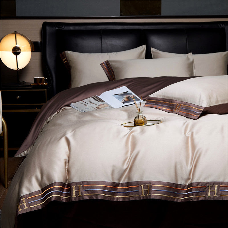 Set di biancheria da letto in cotone satinato ricamato Luminoir, quattro pezzi per camere da letto eleganti